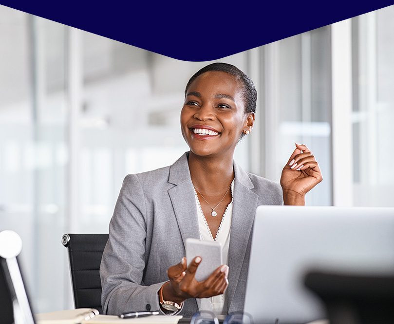 image of a business woman smiling and laptop
